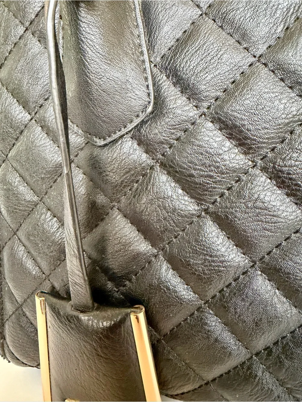 Black Quilted Leather Top-Handle Bag with Gold Trim